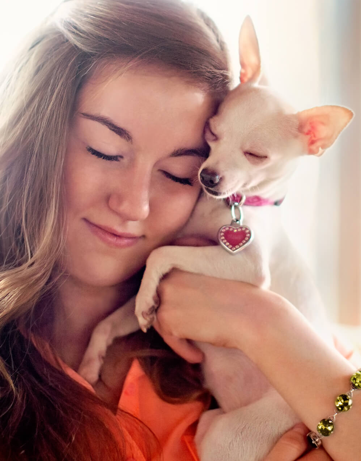 Image of a woman hugging a puppy that links to a pet brand positioning case study for FURminator.
