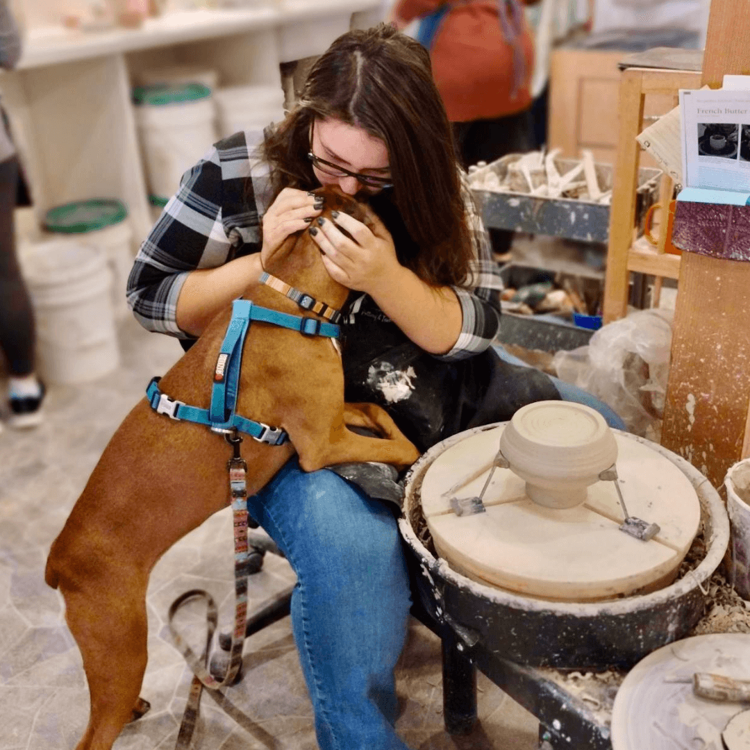 Pserah Darling MarketPlace, kissing dog while being creative